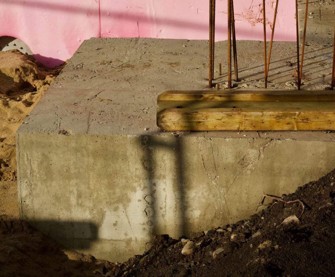 Concrete base with reinforcement starter bars
